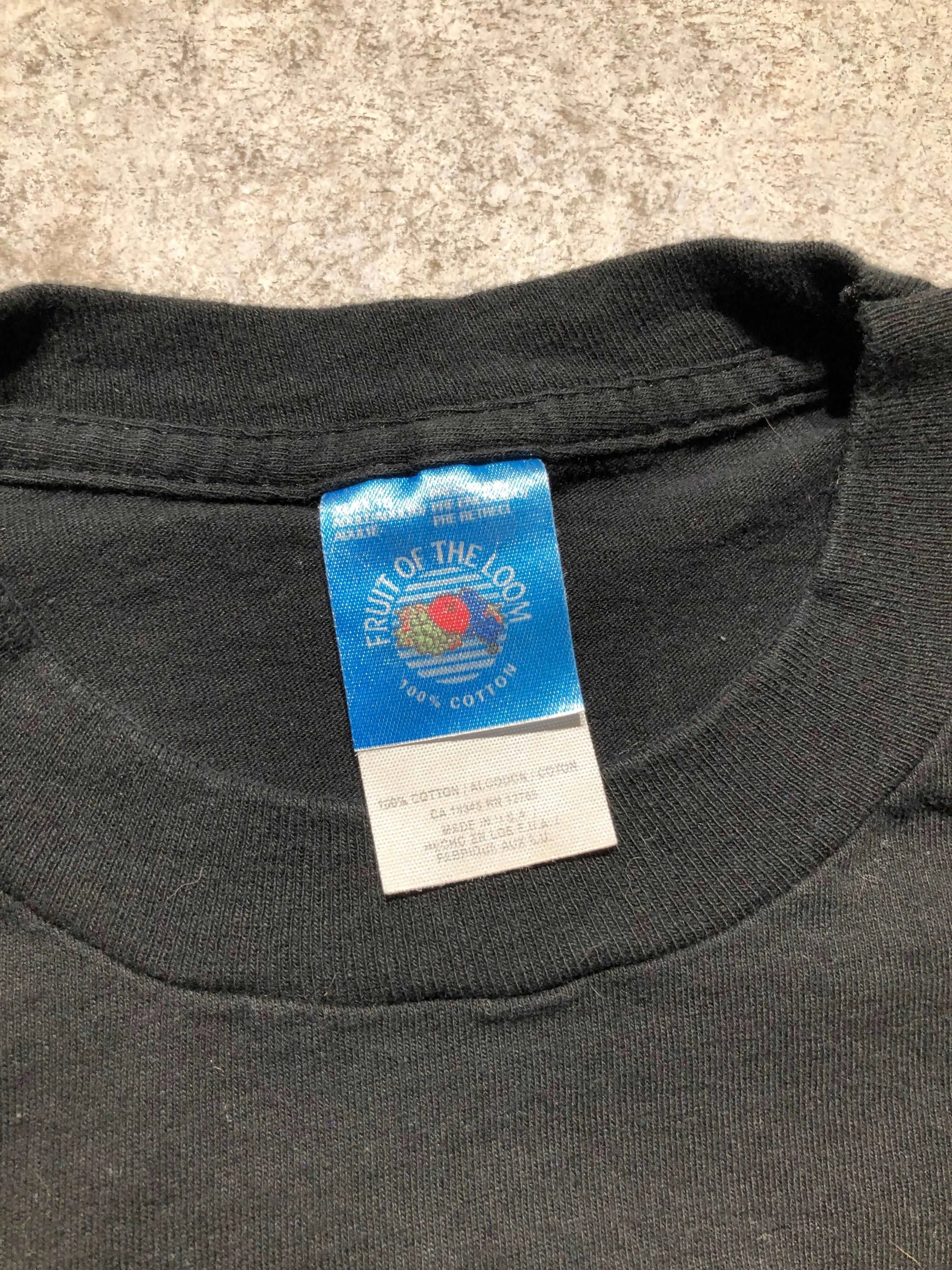 Close-up of a black Fruit of the Loom tag on a vintage 1994 Jim Beam Black Label Whisky tee.