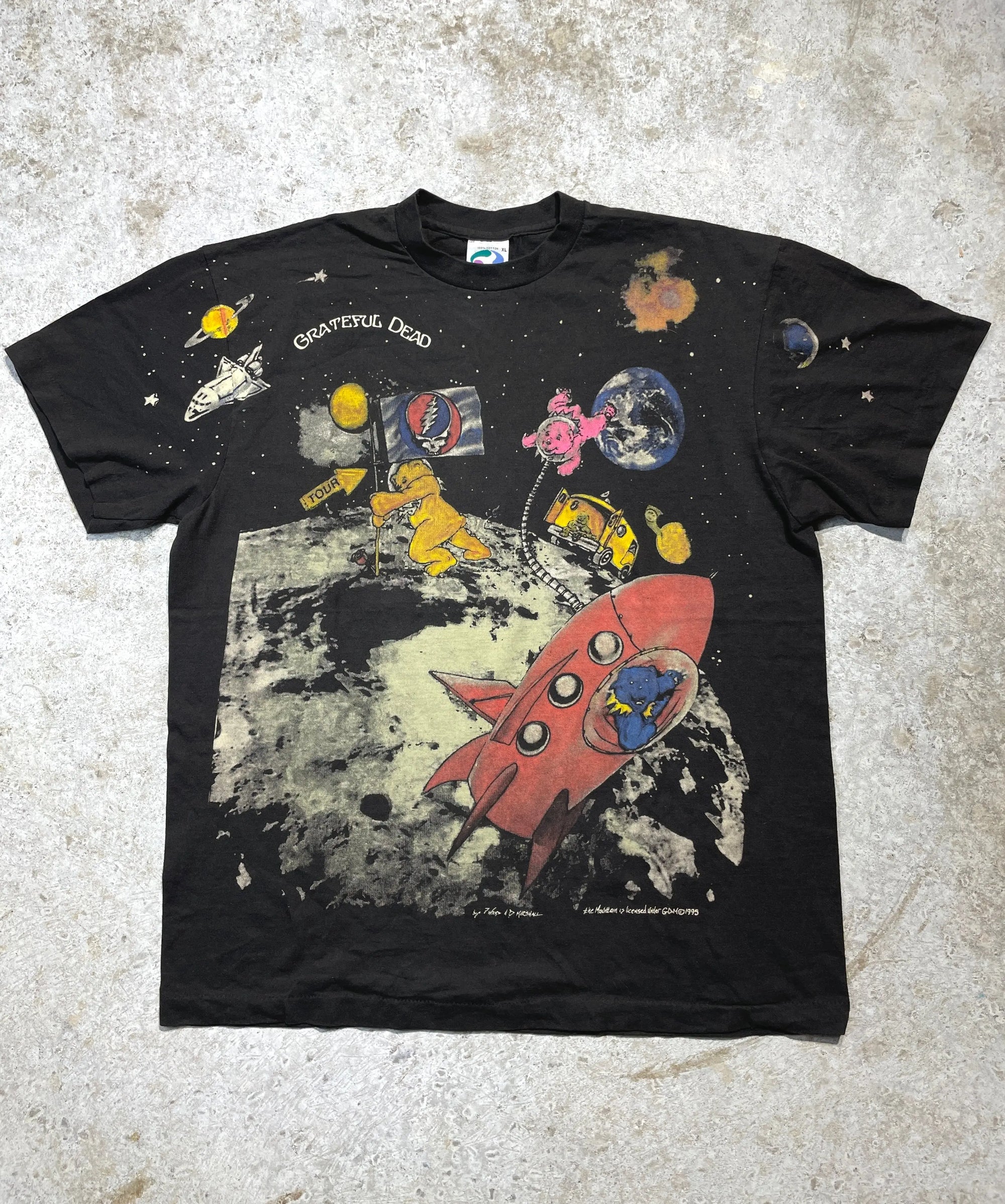 Vintage 1995 Grateful Dead black X-Large tee with an all-over print of space, rockets, and band graphics.