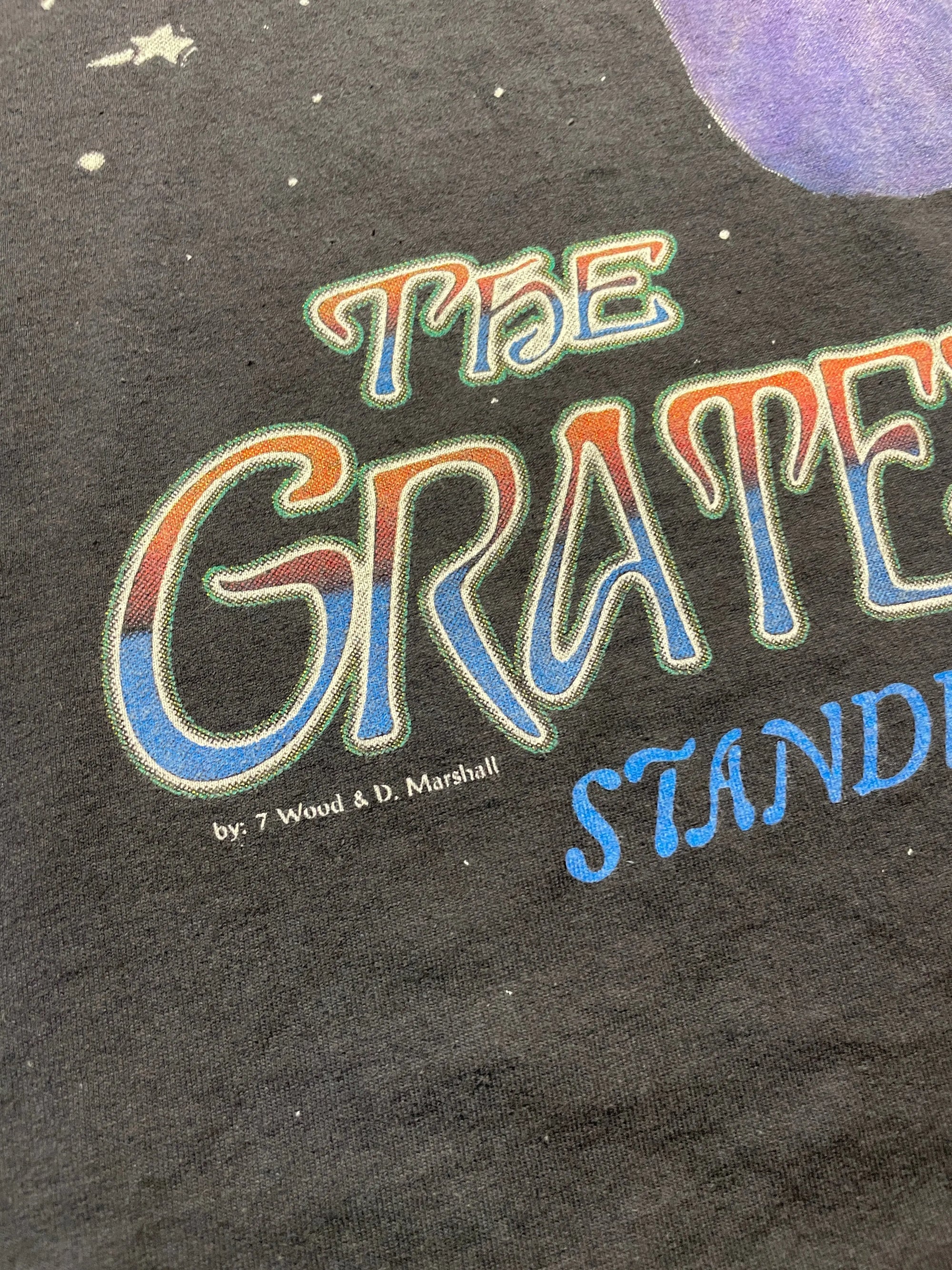 Faded black 1995 Grateful Dead "Standing On The Moon" all-over print tee with colorful text.