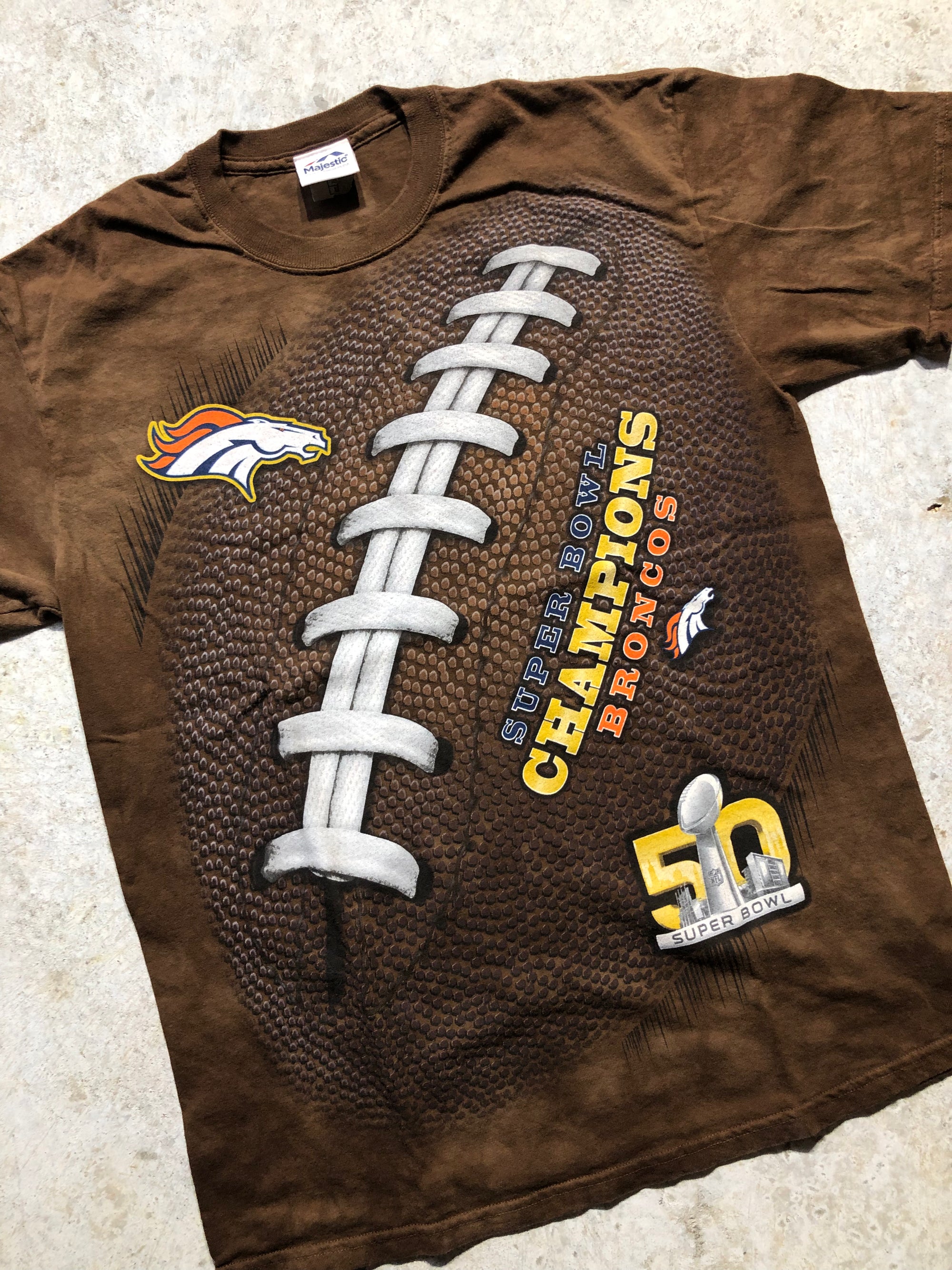 Brown Super Bowl 50 Champions Broncos all-over print tee with football graphic.