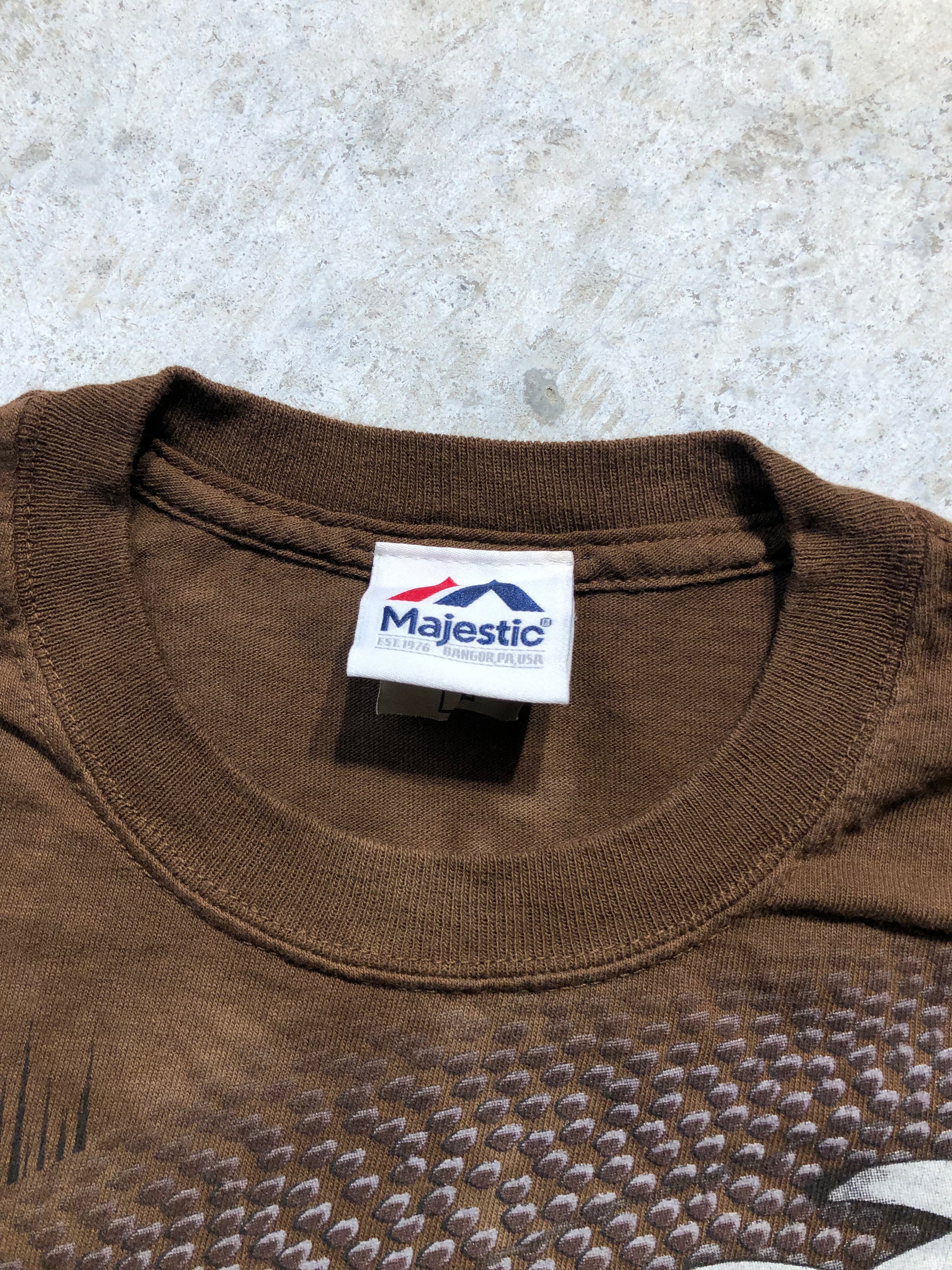 Brown Majestic Super Bowl 50 Champions all-over print tee, size Medium, with a ribbed crew neck.