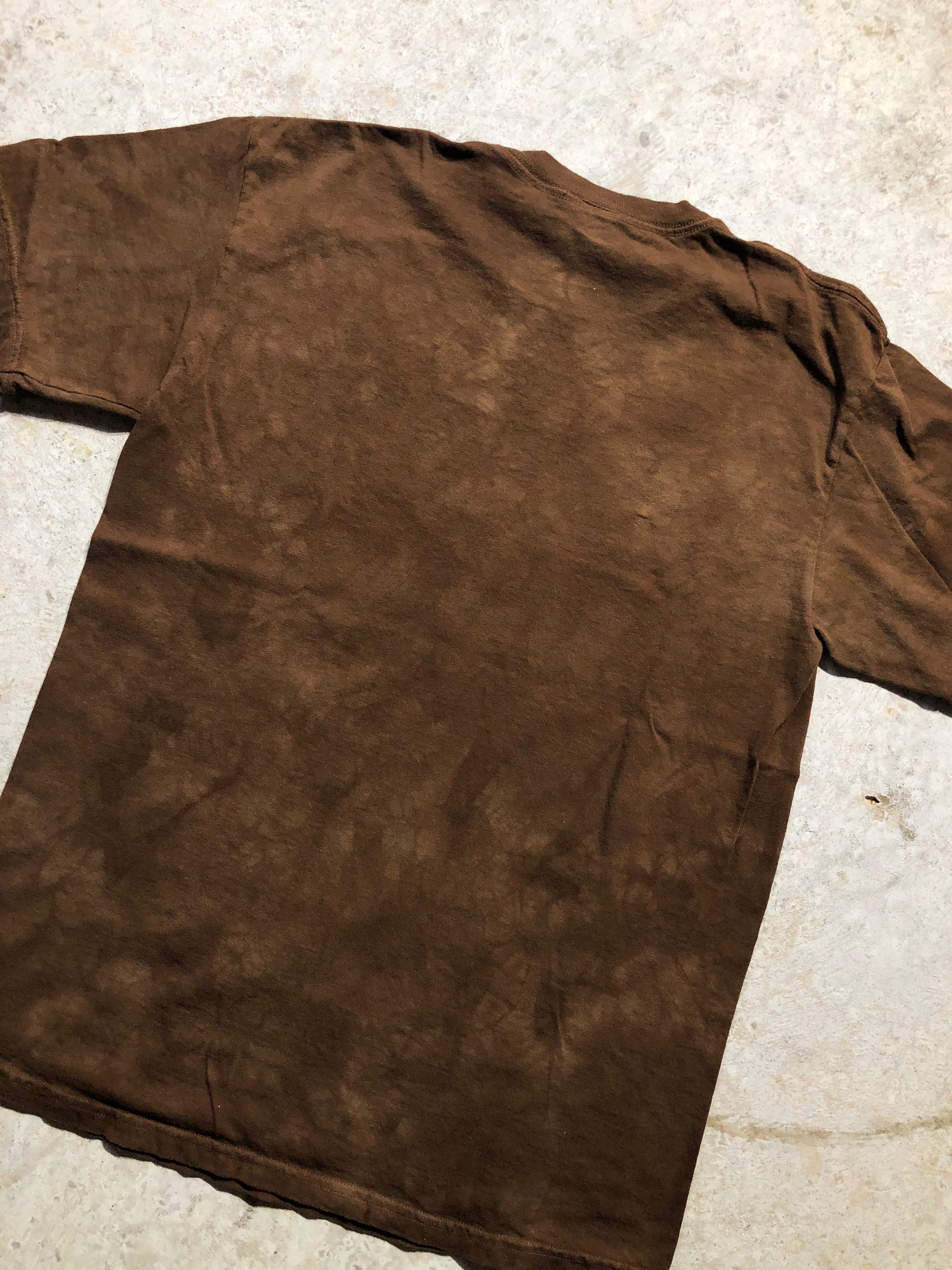 Brown, all-over print Super Bowl 50 Champions Broncos tee, size Medium, made of thick cotton.