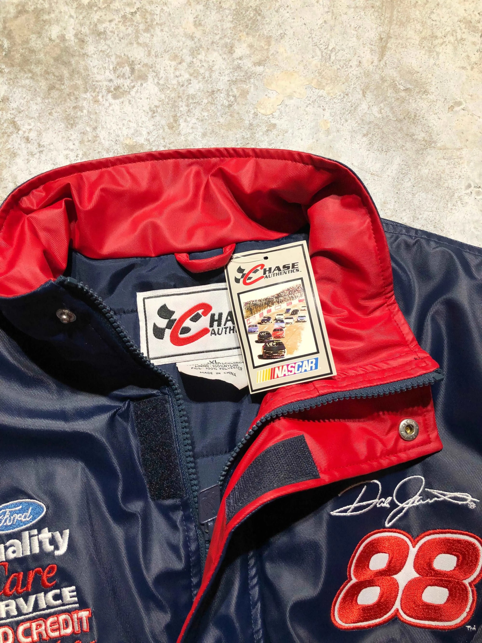 Vintage navy blue Nascar Ford Racing jacket, red collar, #88 Dale Jarrett embroidery, Chase Authentics tag.